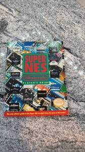 lot 102 image: Used Super NES Nintendo Players Guide Book