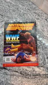 lot 113 image: Nintendo Power Magazine Featuring WWF, Street Fighter II Poster, and Game Guides