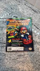 lot 115 image: Nintendo Power Magazine Issue Featuring Mario Kart 64 and GoldenEye 007