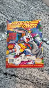 lot 120 image: Nintendo Power Magazine Issue Featuring Bugs Bunny and Super Metroid Poster