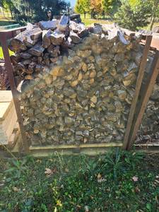 lot 37 image: Stack of Seasoned Firewood in Metal Rack