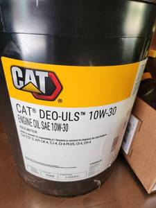 lot 65 image: Automotive Fluids Lot CAT DEO-ULS 10W-30 Oil, Mobil Delvac 1300 Super 15W-40, NAPA ATF, Gold Oil Filter