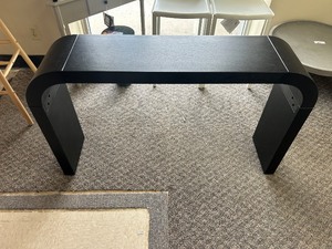 lot 20 image: Safavieh Liasonya Curved Console Table - MSRP $389