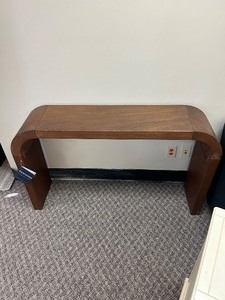 lot 68 image: Safavieh Liasonya Curved Console Table - MSRP $389