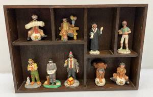 lot 9 image: Misc. Vintage Collectible Miniature Emmett Kelly Clown Figurines With Wood Shelf Display