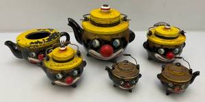 lot 209 image: Antique 1940s Thames Redware Clown Tea Set (Chips And Small Crack On Teapot Lid And Creamer Lid Repaired Some Paint Missing On Small Teapot And Lid Missing ) But Very Cool Pieces