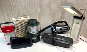 lot 125 image: Lot of 6 Household Electronics Including Lanterns, Heater, Alarm Clock, Desk Lamp, Vacuum, and Sealer