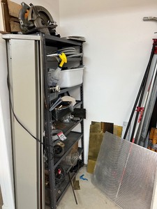 lot 133 image: Workshop Equipment and Material Collection with Hand Tools, Shelving, Metal Sheets, and Clamps