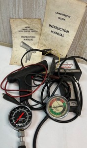 lot 134 image: Automotive Diagnostic Tools Lot with Manuals - Compression Tester, Tach Dwell Meter, Timing Light, Vacuum Tester