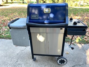 lot 151 image: Weber Genesis Silver Gas Grill with Side Table and Storage Cabinet