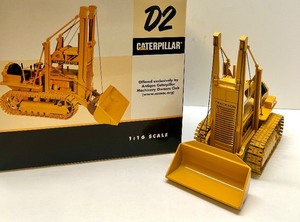 lot 49 image: Caterpillar D2 Traxcavator 116 Scale Diecast Model with Box