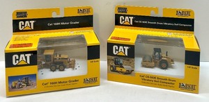 lot 52 image: Set of 2 Cat Die-Cast 187 Scale Models 160H Motor Grader & CS-563E Soil Compactor