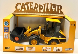 lot 57 image: Bruder 116 CAT Wheel Loader Toy with Wooden Caterpillar Sign