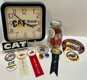 lot 64 image: CAT Diesel Power Clock, Pioneer Power Buttons, Ribbons, and Decals Collection
