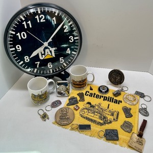 lot 69 image: Caterpillar Collectibles Lot Wall Clock, Mugs, Keychains, Medallions, and Memorabilia