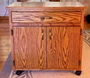 lot 95 image: Rolling Oak Storage Cabinet with Drawer and Shelves