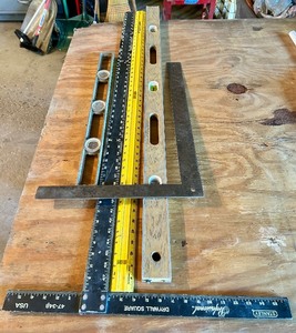 lot 179 image: Group of 5 Hand Tools Including Squares, Rulers, and Levels