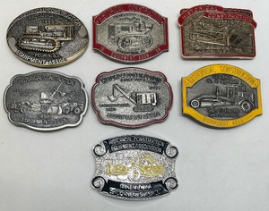 lot 13 image: Collection of 7 Historical Construction Equipment Association CAT Belt Buckles Solid Brass