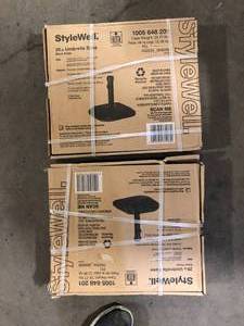 lot 11 image: Lot of StyleWell 26 lbs. Concrete and Resin Patio Umbrella Base in Black  Customer Returns See Pictures