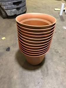 lot 31 image: Vigoro 20 in. Mirabelle Large Clay Plastic Pot (20 in. D x 17 in. H) with Drainage Hole and Attached Saucer ( 12 Pack) Customer Returns See Pictures