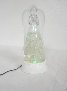 lot 136 image: Hallmark Angel (electric, color changing, snow-globe-swirls when on)