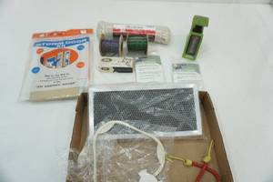lot 417 image: Storm Door Kit, Staples, Ponchos, 100ft rope, scale, filter, microwave rotisserie wheel