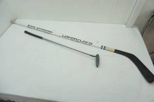 lot 593 image: Hockey Stick & Golf Putter