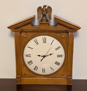 lot 63 image: LL - Howard Miller Patriotic Wall Clock with Eagle Topper and Roman Numerals