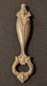 lot 99 image: LL - Vintage Brass Bottle Opener with Queen Motif