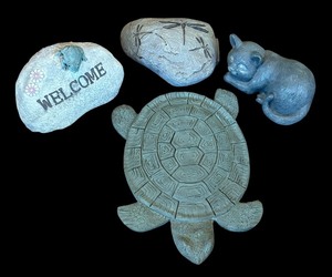lot 84A image: P - Set of 4 Decorative Garden Statues and Stones