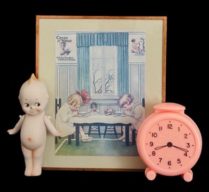 lot 139H image: FLR - Vintage Cream of Wheat Print 1907, Bisque Doll, and Pink Plastic Clock Set