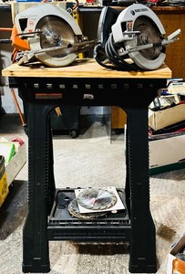 lot 207H image: GS - Lot of 2 Black & Decker 7-14 in Circular Saws with Extra Blades and Stand