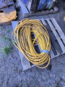 lot 32 image: Heavy Duty Yellow spray hose