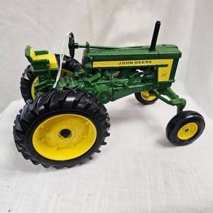 lot 70 image: 16 John Deere 720 Wide Front Tractor