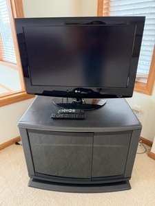 lot 97 image: LG Model 32LG30 TV & Stand