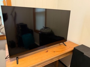 lot 77 image: TCL Model 435451 43 Television with Remote