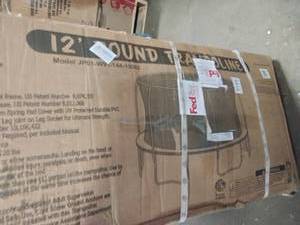 lot 56 image: 12 Round Trampoline with Enclosure