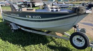 lot 3 image: 1976 Sylvan Back Troller 45 hp 2 stroke and Shorlander Roller Trailer
