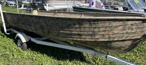 lot 5 image: Camoflauge 16 tiller boat with NO motor on bunk trailer.