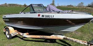 lot 10 image: 1985 Forrester 16 Runabout with Mercuiser 3.0L and Yacht Club bunk trailer.