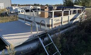 lot 12 image: 1999 Weres Sportsman 20 pontoon with NO trailer and Johnson 28 motor.  Floor and furniture in good condition.