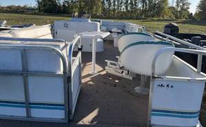 lot 15 image: 1994 Spectrum Sunset Hideaway 24 pontoon with NO trailer.  Motor was bad upon trade in so will need a motor.  Floor, furniture, and toons are all in good condition.    Selling as is.
