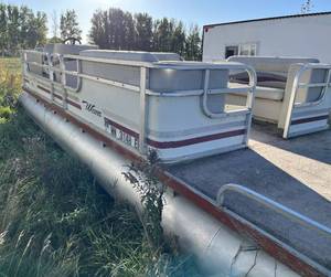 lot 17 image: 1984 Weres Aqua Deck 24 pontoon with NO motor and NO trailer.  Floor is good but upholstery needs some work.