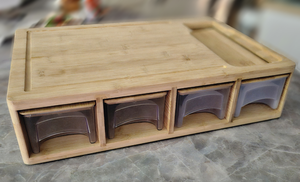 lot 55 image: Bamboo cutting board with bins for chopped veggies,