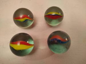 lot 91 image: Four Large Cats Eye Marbles