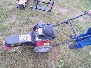 lot 7 image: Swisher Trim - n - mow