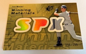 lot 21A image: Joe Mauer Relic 199 2007 SPx Winning Materials #WM-JM Numbered 006199 Minnesota Twins Baseball Card