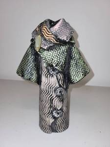lot 11H image: Signed Art Pottery Sculpture Coat Figure with Pendant Detail