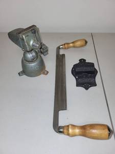 lot 15H image: Vintage Bench Vise, Wood Handle Drawknife, and Cast Iron Wall Match Holder Set