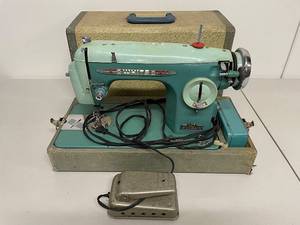 lot 39K image: Vintage White Sewing Machine with Case and Foot Pedal, Retro Teal Color